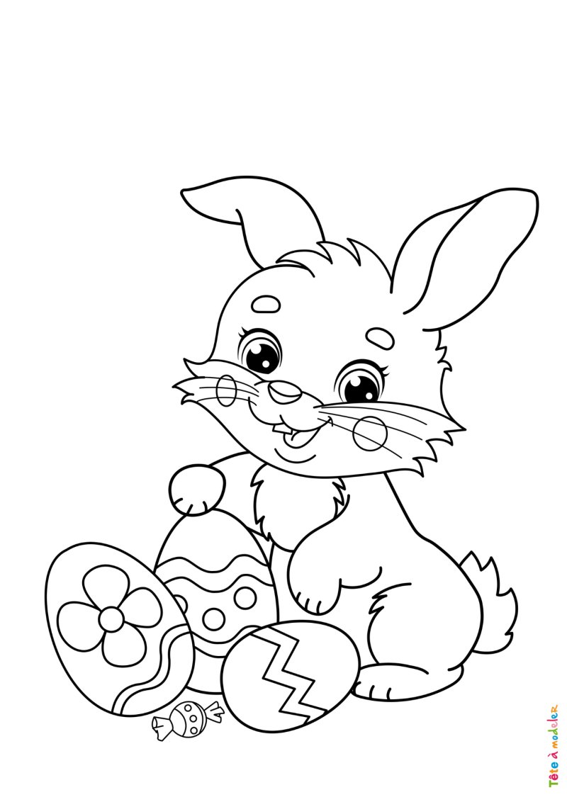 Coloriage de lapin a coté de 3 oeufs de Pâques