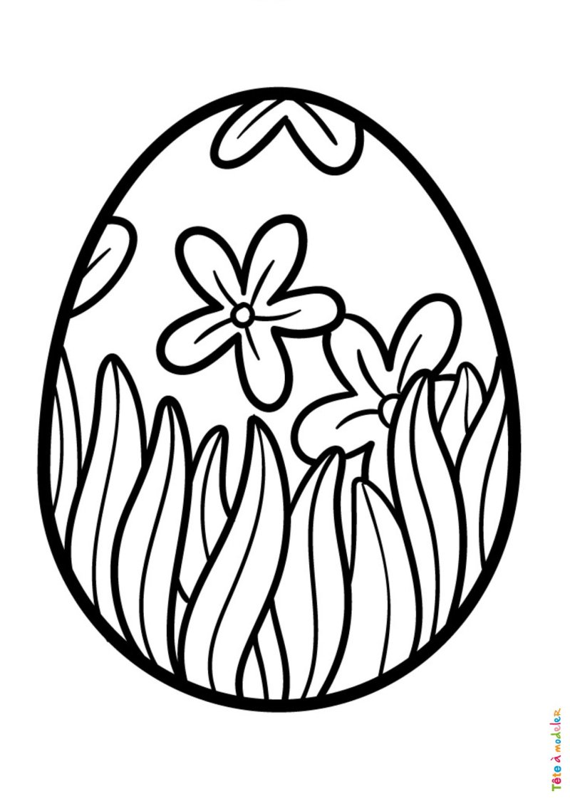 Coloriage d'un oeuf de Pâques avec de l'herbe et des fleurs