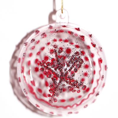 Boule de Noël en transparence rouge et paillettes