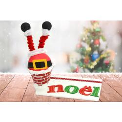 Père Noël coincé dans la cheminée