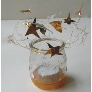 Photophore décoré d'étoiles dorées en métal