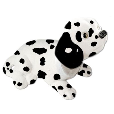 Chien à la tête mobile